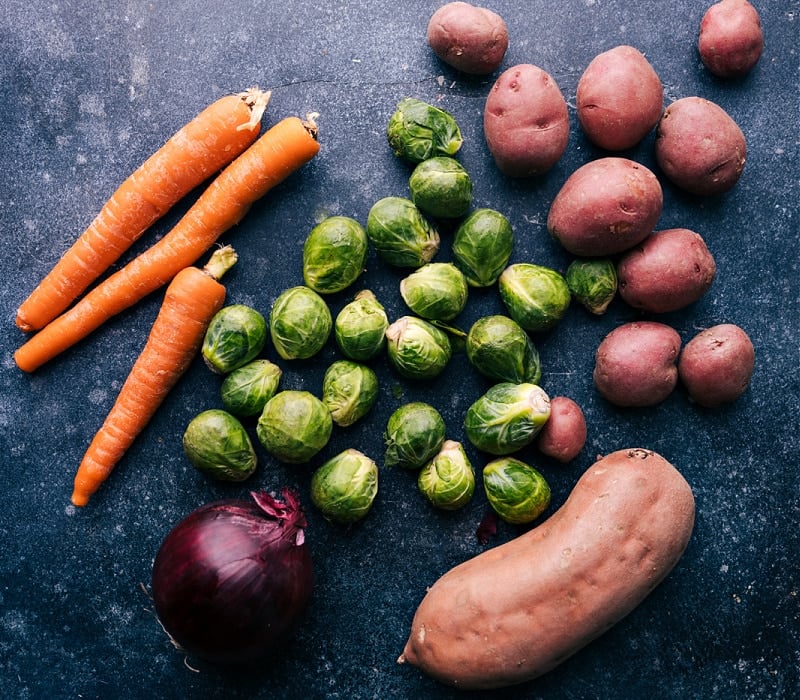 A basket filled with various fresh fruits and vegetables